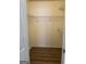 A walk-in closet with custom storage shelving and floors at 135 Courtyard Ln, Fayetteville, GA 30215