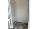 Entryway featuring tiled flooring and a storm door leading to the exterior at 135 Courtyard Ln, Fayetteville, GA 30215