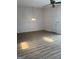 A living room with modern floors, ceiling fan, and neutral walls at 135 Courtyard Ln, Fayetteville, GA 30215
