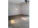 Spacious living room with ceiling fan, light fixture, hardwood floors, and natural light at 135 Courtyard Ln, Fayetteville, GA 30215