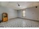 Finished basement featuring ceramic tile flooring, window and neutral paint at 2436 Green Hollow Ct, Conyers, GA 30012