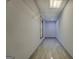 Long empty closet space, with ceramic tile flooring at 2436 Green Hollow Ct, Conyers, GA 30012