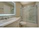 Bathroom featuring tub-shower combo, marble vanity, and contemporary lighting at 2436 Green Hollow Ct, Conyers, GA 30012