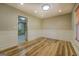 Dining room with wood floors, wainscoting and modern lighting fixtures at 2436 Green Hollow Ct, Conyers, GA 30012
