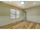 Bright dining area featuring wood floors and large window overlooking the front yard at 2436 Green Hollow Ct, Conyers, GA 30012
