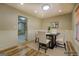 Staged dining room featuring a modern table setting, wainscoting, and hardwood floors at 2436 Green Hollow Ct, Conyers, GA 30012