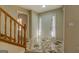 Bright foyer features decorative tile flooring, closet, and a wood staircase at 2436 Green Hollow Ct, Conyers, GA 30012