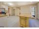 Kitchen featuring an island with granite countertops, white cabinets, and tile floors at 2436 Green Hollow Ct, Conyers, GA 30012