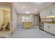 Kitchen with an island, white cabinets, stainless steel appliances, and tiled floors at 2436 Green Hollow Ct, Conyers, GA 30012
