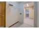 Laundry room with shelving, tile flooring, and access to kitchen at 2436 Green Hollow Ct, Conyers, GA 30012