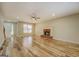 Inviting living room boasts hardwood floors, a fireplace, and a bright, airy feel at 2436 Green Hollow Ct, Conyers, GA 30012