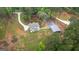 Aerial view of the two-story home with a horseshoe driveway and a detached garage at 337 Paynes Lake Rd, Carrollton, GA 30116