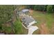 Aerial view of a home with a large yard, outbuilding, and horseshoe driveway at 337 Paynes Lake Rd, Carrollton, GA 30116