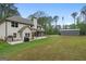 Backyard view of a two-story house with a detached garage at 337 Paynes Lake Rd, Carrollton, GA 30116