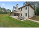 Rear exterior with patio featuring lounge chairs, and fenced backyard at 337 Paynes Lake Rd, Carrollton, GA 30116
