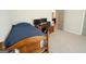 Simple bedroom setup including a wooden desk, chair, and a standard bed with workspace at 337 Paynes Lake Rd, Carrollton, GA 30116