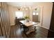 Charming dining room with farmhouse table, decorative wall paneling, and elegant lighting at 337 Paynes Lake Rd, Carrollton, GA 30116