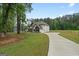 Beautiful two-story home featuring a long driveway and a spacious lawn at 337 Paynes Lake Rd, Carrollton, GA 30116