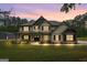 Beautifully illuminated home at dusk, accentuating its elegant architecture and curb appeal at 337 Paynes Lake Rd, Carrollton, GA 30116