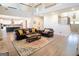 Bright living room with high ceilings, hardwood floors, and comfortable leather furniture at 337 Paynes Lake Rd, Carrollton, GA 30116