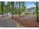 Scenic view of the home and barn nestled among the trees, offering a private setting at 337 Paynes Lake Rd, Carrollton, GA 30116