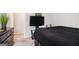 Bedroom includes ample light, dresser and a television at 210 Jenny Ct, Grantville, GA 30220