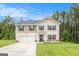 Charming two-story home featuring a two-car garage and well-maintained front lawn at 210 Jenny Ct, Grantville, GA 30220