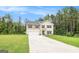 Inviting two-story home with an attached two-car garage, and concrete driveway at 210 Jenny Ct, Grantville, GA 30220
