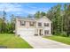 Beautiful two-story home with a two-car garage, situated on a well-manicured lawn at 210 Jenny Ct, Grantville, GA 30220