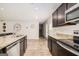 Well-equipped kitchen featuring wood cabinets, granite countertops and breakfast bar at 210 Jenny Ct, Grantville, GA 30220