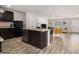 Modern kitchen with granite countertops, stainless steel appliances, and central island at 210 Jenny Ct, Grantville, GA 30220