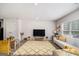 Open-concept living room featuring recessed lighting, wood flooring, and large windows at 210 Jenny Ct, Grantville, GA 30220