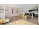 Open living area with modern decor, breakfast bar and wood floors at 210 Jenny Ct, Grantville, GA 30220
