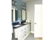 A spacious bathroom with double sink vanity, granite countertop, and plenty of cabinet storage at 165 Woodgate Cir, Fayetteville, GA 30214