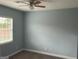 A bright bedroom with a ceiling fan, neutral carpet and a window with white blinds at 165 Woodgate Cir, Fayetteville, GA 30214