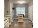 Cozy dining area with table, natural light, and adjacent kitchen at 165 Woodgate Cir, Fayetteville, GA 30214