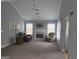 Bright living room featuring a fireplace, neutral paint, and comfortable seating at 165 Woodgate Cir, Fayetteville, GA 30214