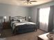 Comfortable bedroom with carpet, ceiling fan, and ample natural light at 165 Woodgate Cir, Fayetteville, GA 30214