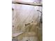 A tiled shower with a grab bar, built in seat, and attractive tilework at 165 Woodgate Cir, Fayetteville, GA 30214