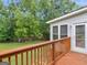 Lovely wood deck overlooking the lush lawn and scenic creek at the rear of the home at 114 Overlook Dr, Mcdonough, GA 30252