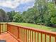 Wide backyard and a wood deck perfect for entertaining or enjoying a peaceful view at 114 Overlook Dr, Mcdonough, GA 30252
