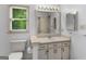 Bathroom features large mirror, vanity sink, and adjacent toilet at 114 Overlook Dr, Mcdonough, GA 30252