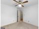 Spacious bedroom with carpet, ceiling fan, and a doorway to another room at 114 Overlook Dr, Mcdonough, GA 30252