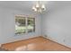 Dining area offers hardwood floors and a classic chandelier for elegant meals at 114 Overlook Dr, Mcdonough, GA 30252