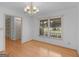 Charming dining area features hardwood floors and views of the outdoor scenery at 114 Overlook Dr, Mcdonough, GA 30252
