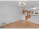 Dining room with hardwood and view of the kitchen with wooden cabinets at 114 Overlook Dr, Mcdonough, GA 30252
