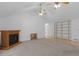 Open living room featuring fireplace and custom built-in shelving at 114 Overlook Dr, Mcdonough, GA 30252
