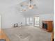 Inviting living area with carpet, fireplace and access to a sunroom at 114 Overlook Dr, Mcdonough, GA 30252
