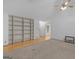 Spacious living room featuring hardwood floors, built-in shelves and neutral walls at 114 Overlook Dr, Mcdonough, GA 30252