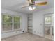 View of the bedroom with ensuite bathroom, built-ins, and natural light at 114 Overlook Dr, Mcdonough, GA 30252
